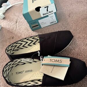 TOMS Classic Black Canvas Slip-Ons